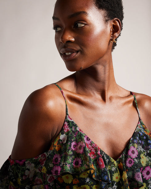 PRIYAHH-Trousers-Need an outfit to match your sunny disposition? Look no further than PRIYAHH. With ruffled off-shoulder sleeves and a flattering V-neck, this romper is perfect for any occasion from weekend brunch to a beach day. Plus, adjustable straps ensure a comfortable fit.The fabric of this product is made with 55% recycled polyester. Using recycled polyester helps divert plastic waste from ending in landfills, and helps us to reduce our dependence on virgin materials. Romper Off shoulder sleeves with